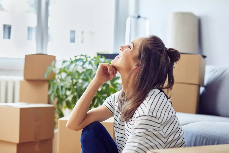 Smiling woman with storage boxes